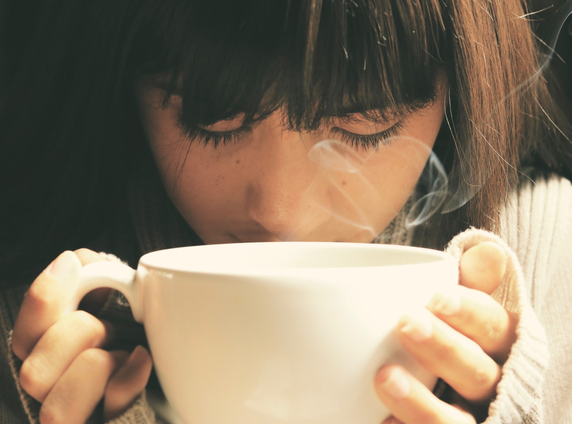 Woman drinking hot tea 