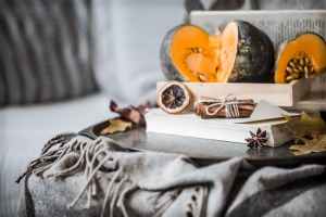 Autumn decorations with pumpkin book and dried fruit