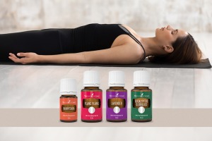 Mujer meditando con aceites esencialese de ylang ylang, lavanda, eucalyptus globulus y alcanforero