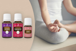 Frankincense, Lavender & Neroli essential oils with person meditating