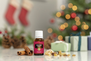 Christmas Spirit essential oil with festive indoor scene