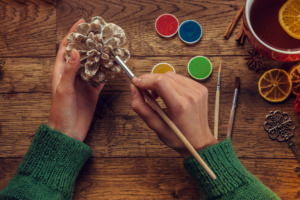 Image of pinecones being painted.