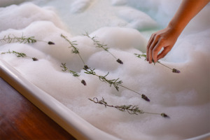 Image of filled bathtub with botanicals.