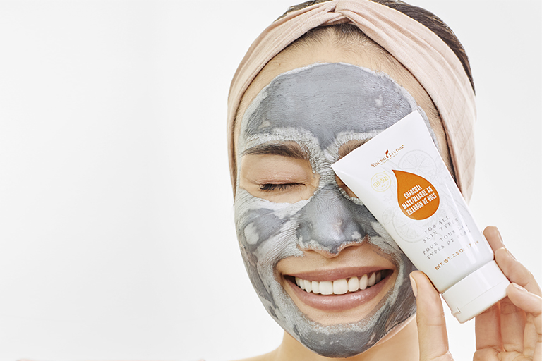 Image of a woman wearing YL Charcoal Mask.