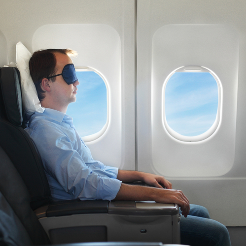 Man Sleeping on Plane