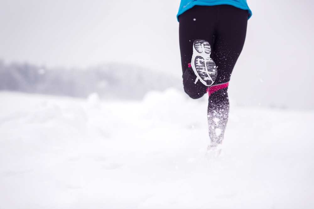 Woman running in snow