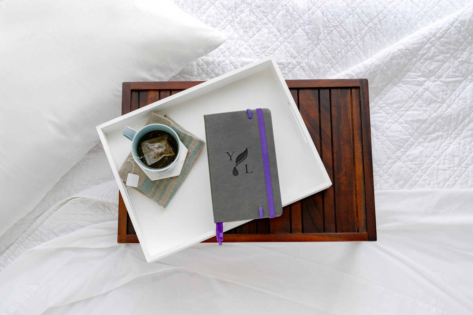 Young Living Journal on a bed
