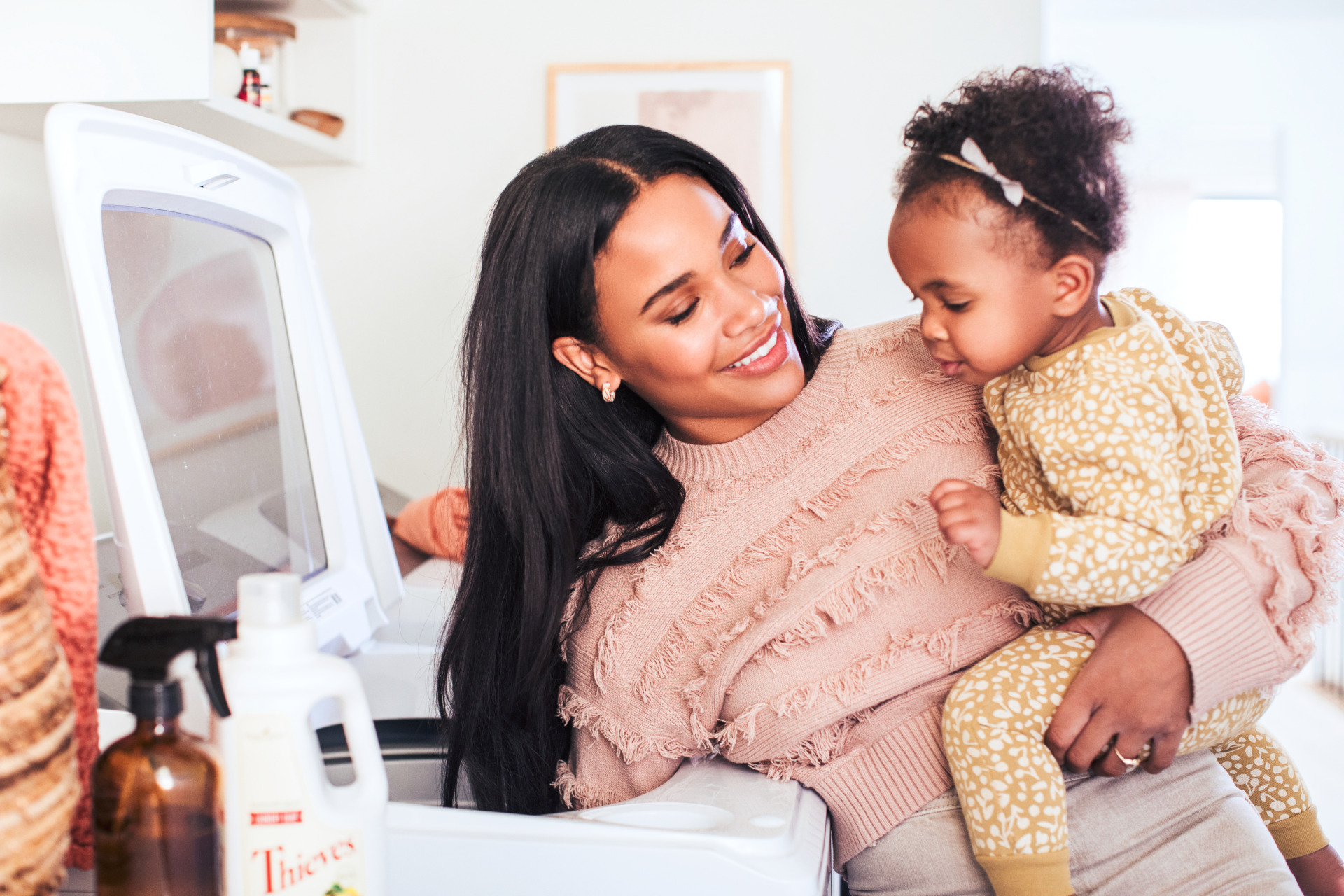 Mom and baby doing laundry