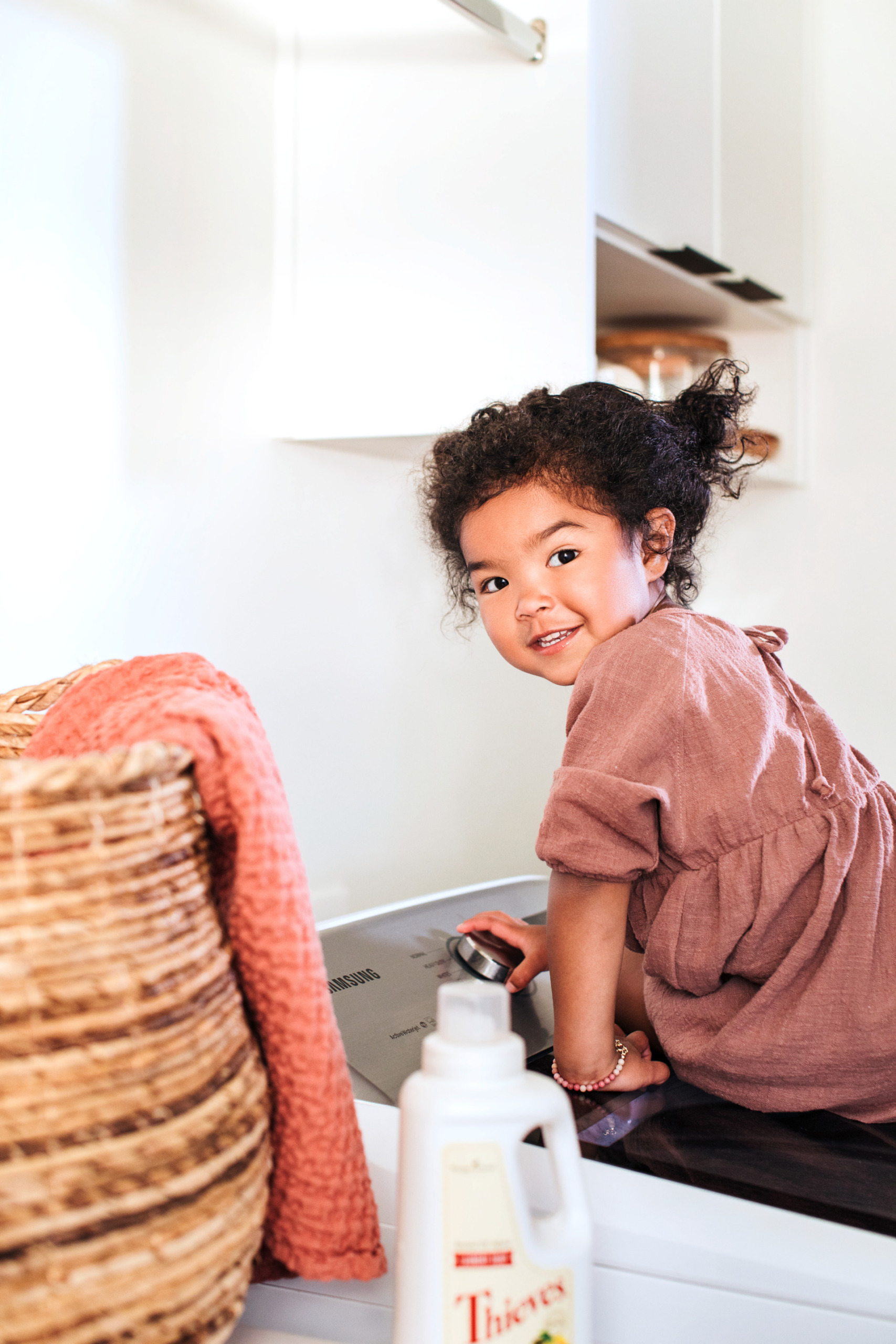 Cute girl on washing mashing