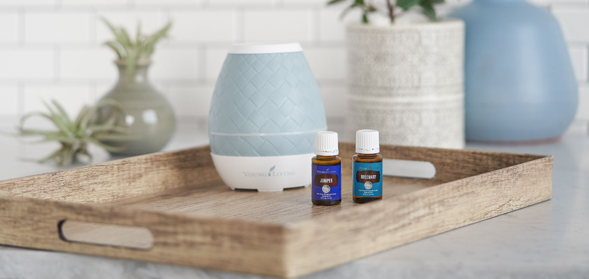 A diffuser and two essential oil bottles in a kitchen