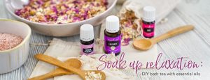 bowls of diy bath tea with essential oils, epsom salt, and flower petals