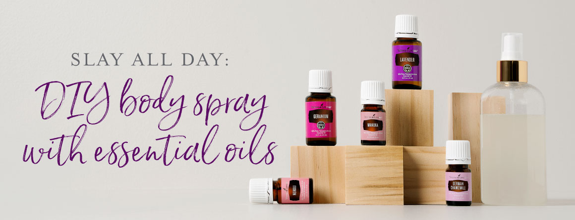 essential oils used for a DIY body spray recipe standing on wooden blocks