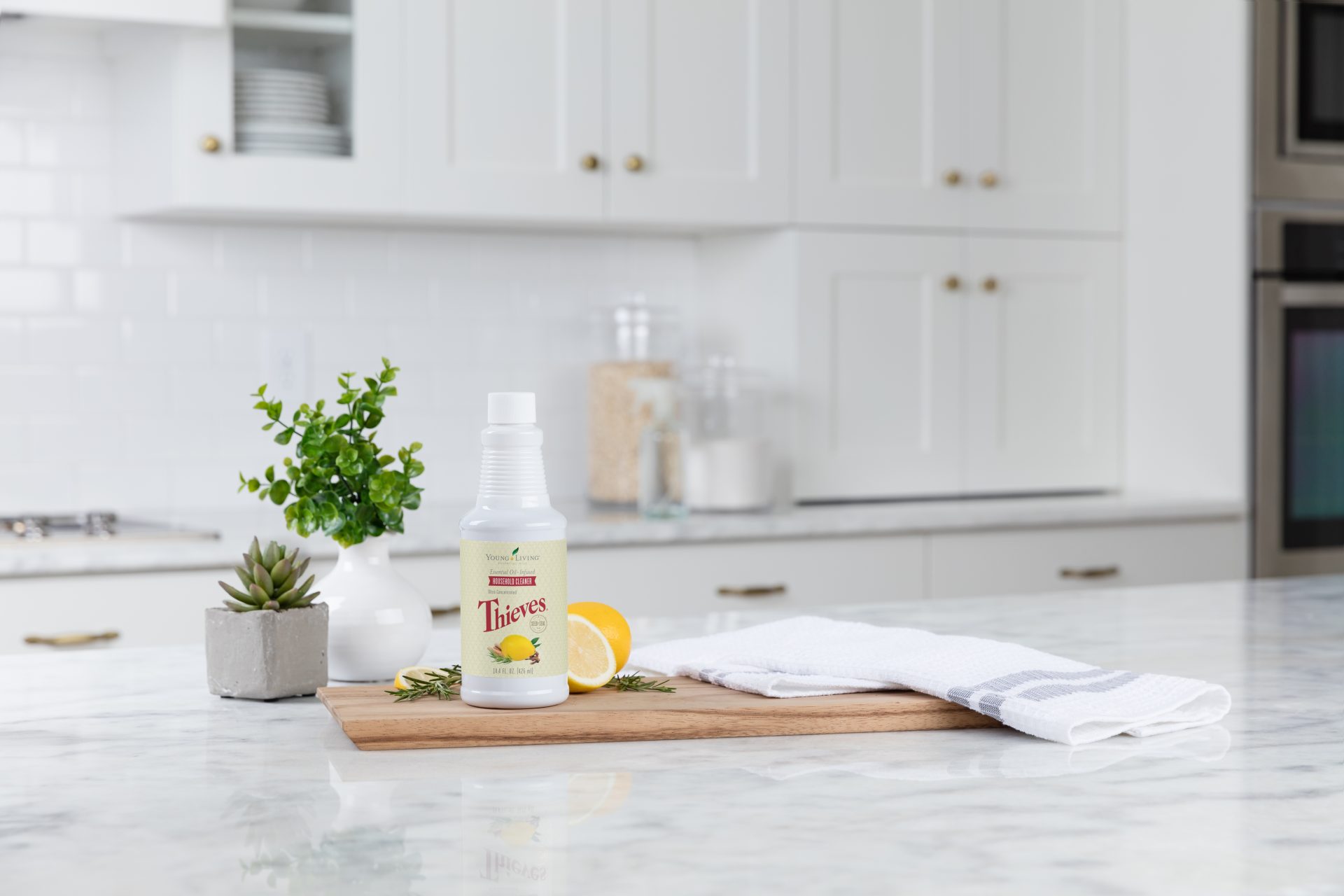Thieves household cleaner on a marble kitchen counter