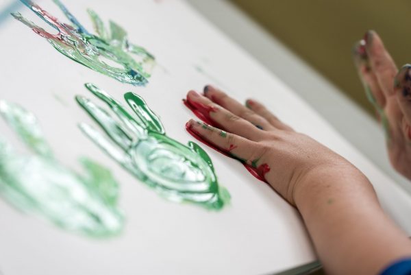 iStock-1021782520 a child finger painting