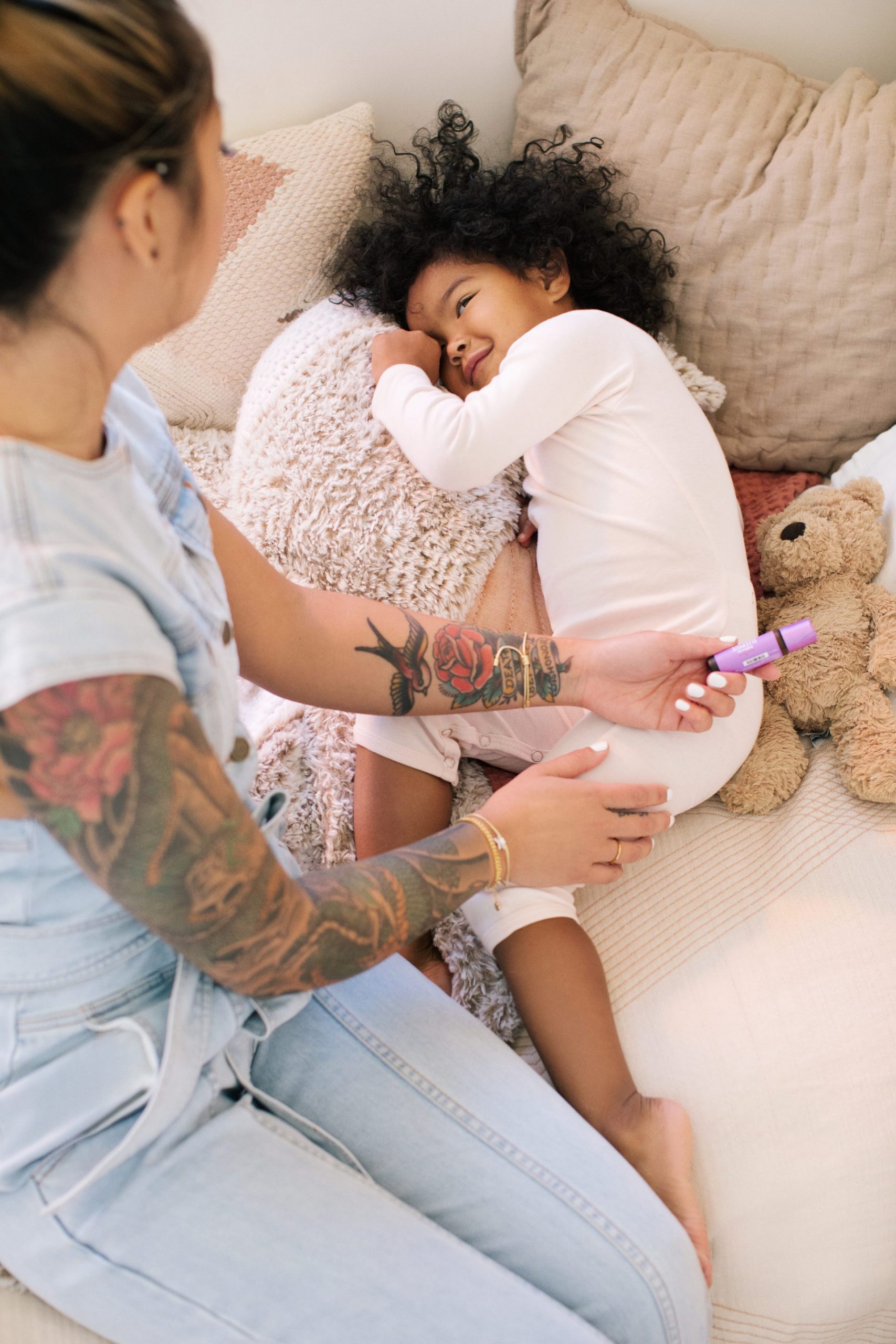 YL_D5_Lifestyle_Caring Moment_077 Mom and child with Young Living essential oils