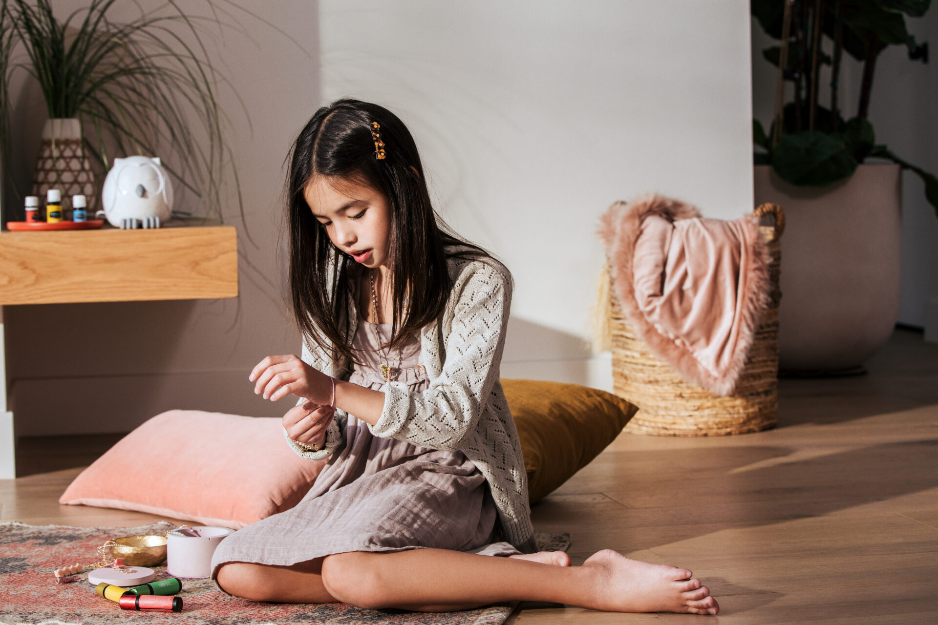 Little girl with KidScents roll-ons and essential oils - Young Living Lavender Life Blog