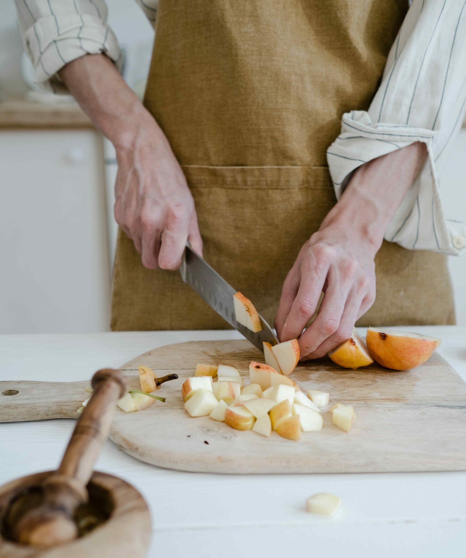 Person cutting apples into slices - Young Living Lavender Life Blog 