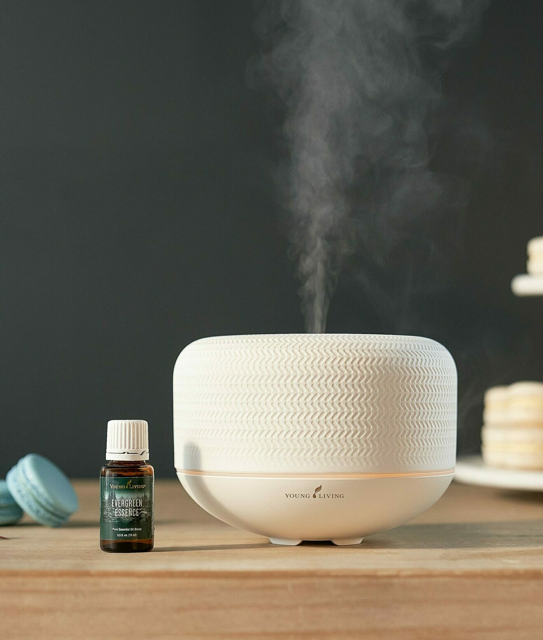 Evergreen Essence sitting next to Macaron diffuser - Young Living Lavender Life blog