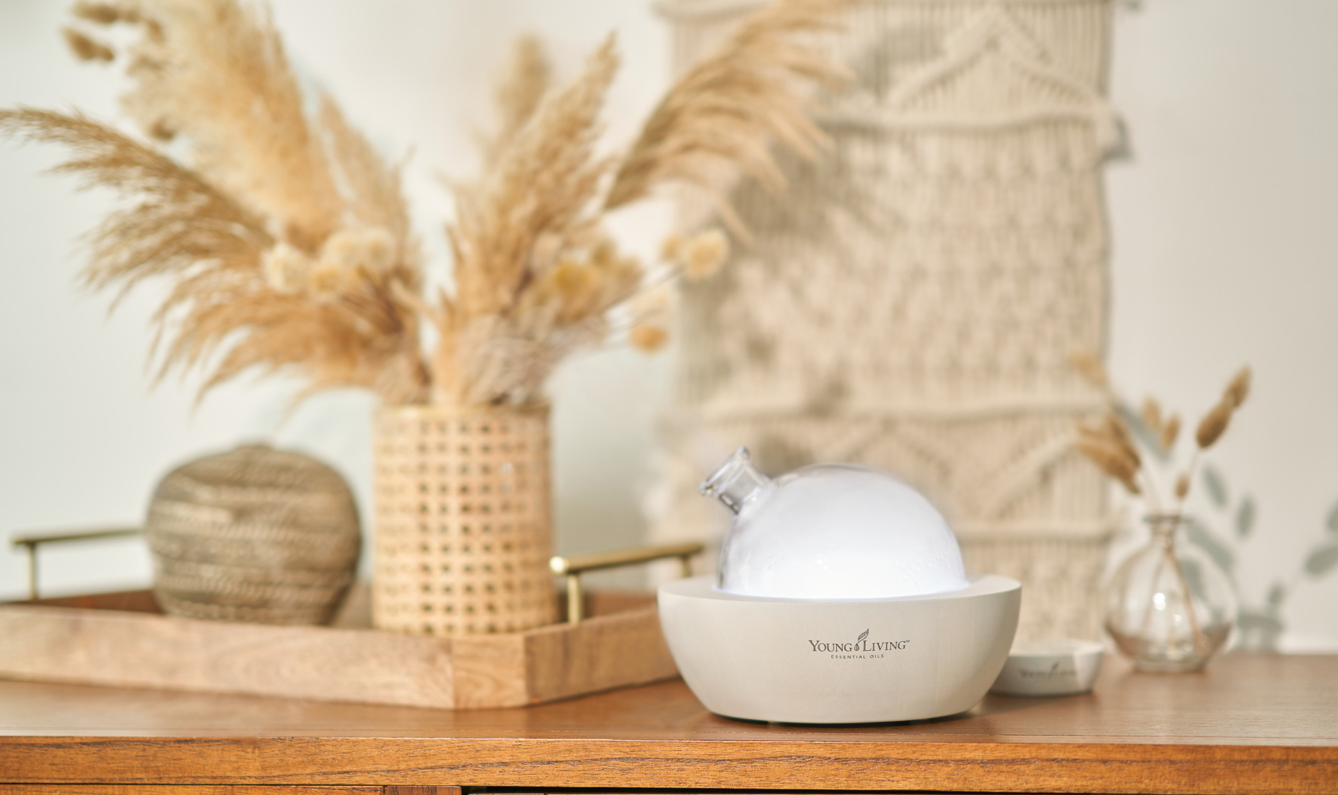 White Aria diffuser sitting on table - Young Living Lavender Life Blog