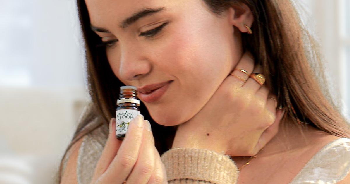 bloomessentialoil Woman smelling BLOOM essential oil