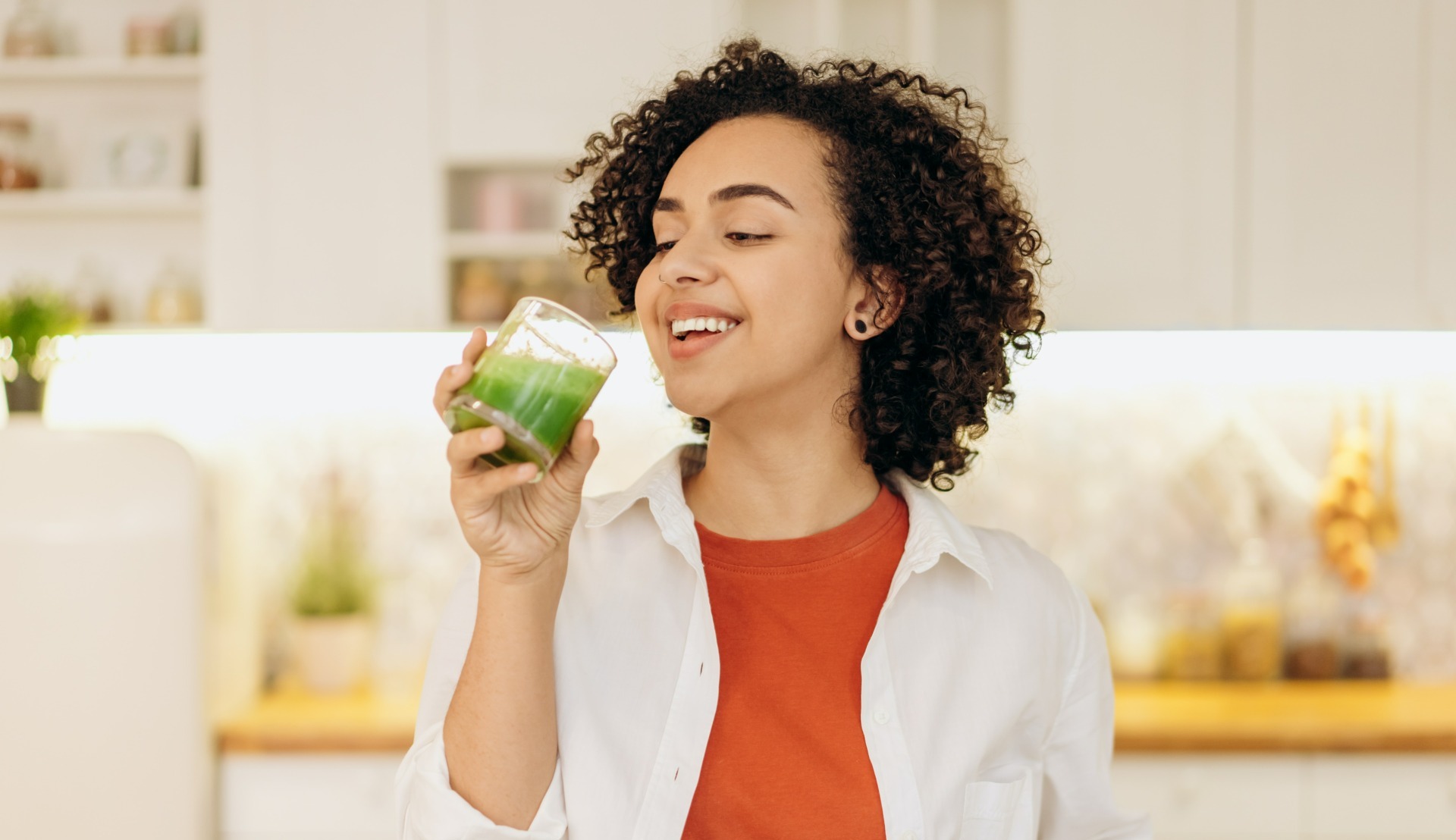 pexels-mikhail-nilov-6707378 Woman drinking green smoothie - Young Living Lavender Life Blog