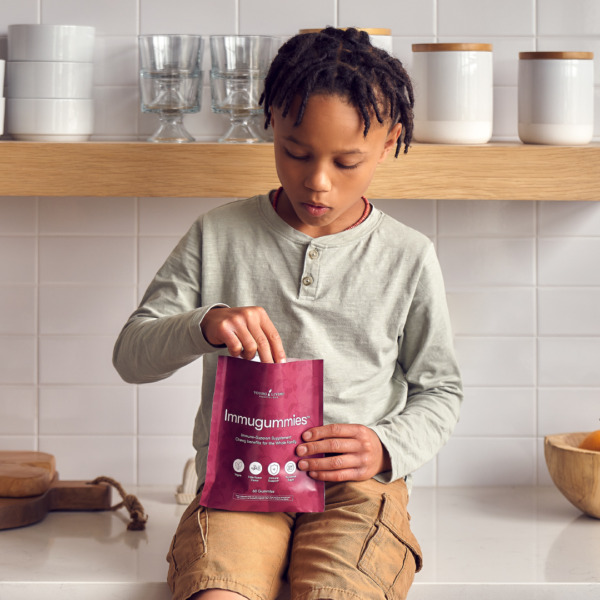 young boy eating immugummies